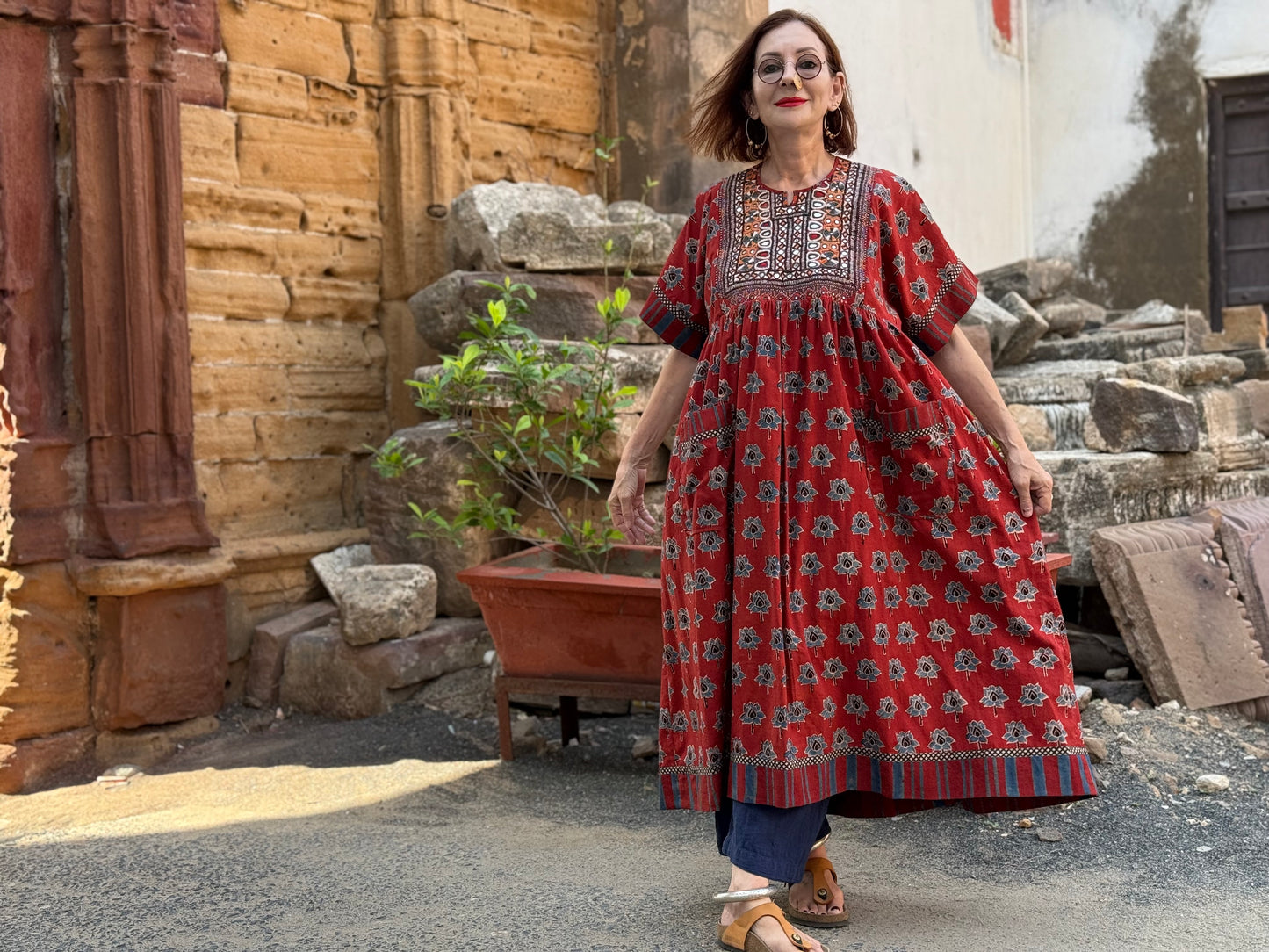 Vintage Kutch embroidery highlights the bodice of this red Ajrakh dress