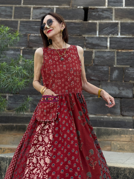 Sleeveless red jumper dress with Kutch hand embroidery on the pocket