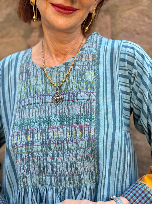 Blue striped Khadi cotton dress with designer patchwork and smocked embroidery bodice.