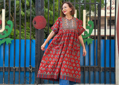 Vintage Kutch embroidery highlights the bodice of this red Ajrakh dress