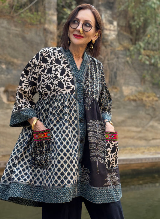 Colorful Kutch hand embroidery decorates this Cotton Tunic in a mixed print design of hand printed Ajrakh.